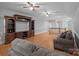 Expansive living room features hardwood floors, a large entertainment center, and comfortable seating at 654 9Th N St, Albemarle, NC 28001