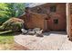 Brick patio with outdoor seating and string lights, perfect for relaxation at 654 9Th N St, Albemarle, NC 28001