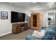 Finished basement featuring a TV, wooden entertainment center, and an infrared sauna for relaxation and wellness at 7221 High Point Ct, Charlotte, NC 28278