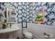 Half bathroom showcasing artistic wallpaper, decorative mirror, and pedestal sink at 7221 High Point Ct, Charlotte, NC 28278