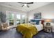 Bedroom featuring decor, a ceiling fan, and access to balcony at 7221 High Point Ct, Charlotte, NC 28278