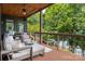 Comfortable deck with seating and wooded views, creating an ideal outdoor space for relaxation and enjoyment at 7221 High Point Ct, Charlotte, NC 28278