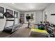 Well-equipped home gym featuring a treadmill, exercise bike, and free weights for a complete workout experience at 7221 High Point Ct, Charlotte, NC 28278