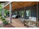 Cozy brick patio with comfortable seating, string lights, and a peaceful backyard view, perfect for relaxing evenings at 7221 High Point Ct, Charlotte, NC 28278