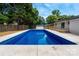 Spacious backyard featuring an in-ground pool perfect for outdoor activities and relaxation at 756 Logan St, Mooresville, NC 28115