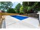Well-manicured backyard featuring an in-ground pool and lush surroundings at 756 Logan St, Mooresville, NC 28115