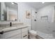 Modern bathroom with marble shower, granite countertop, and stylish fixtures at 756 Logan St, Mooresville, NC 28115