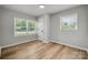 Cozy bedroom with natural light and a view of the neighborhood street at 756 Logan St, Mooresville, NC 28115