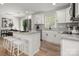 Modern kitchen with stainless steel appliances, granite countertops, and a breakfast bar at 756 Logan St, Mooresville, NC 28115