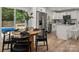 Open-concept kitchen and dining area with a view of the pool and backyard at 756 Logan St, Mooresville, NC 28115