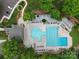Breathtaking aerial view of the community pool and clubhouse, complete with lounge areas and well-manicured landscaping at 9137 Brightleaf Pl, Charlotte, NC 28269