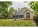 Back of house featuring patio, sunroom, grill, and fenced yard at 9137 Brightleaf Pl, Charlotte, NC 28269