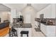 Modern kitchen with white cabinets, granite countertops, a breakfast bar, and stainless steel appliances at 9137 Brightleaf Pl, Charlotte, NC 28269