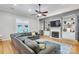 Spacious living room with a fireplace, built-in shelves, and large comfortable couch at 9137 Brightleaf Pl, Charlotte, NC 28269