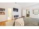 Bright main bedroom with hardwood floors, ensuite bathroom and a calming color palette at 9137 Brightleaf Pl, Charlotte, NC 28269