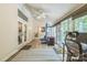Spacious sunroom with exercise equipment and access to the backyard at 9137 Brightleaf Pl, Charlotte, NC 28269