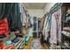 Spacious walk-in closet with shelving and rods for ample storage at 9137 Brightleaf Pl, Charlotte, NC 28269
