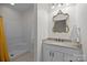 Bright bathroom with a walk-in shower, granite countertops and a gold accented mirror at 9261 Marvin School Rd, Marvin, NC 28173