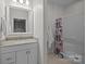 Bright bathroom featuring a single sink vanity and a shower/tub combination at 9261 Marvin School Rd, Marvin, NC 28173