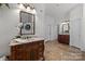 Bathroom featuring & vanities, travertine floors, & built in laundry area at 9261 Marvin School Rd, Marvin, NC 28173