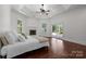 Bright bedroom with hardwood floors, a fireplace, and sliding glass doors to outside at 9261 Marvin School Rd, Marvin, NC 28173