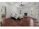 Large primary bedroom with hardwood floors, fireplace, and natural lighting at 9261 Marvin School Rd, Marvin, NC 28173