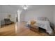 Bright bedroom with hardwood floors, a ceiling fan and cozy seating at 9261 Marvin School Rd, Marvin, NC 28173