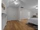 Large bedroom with hardwood floors, white trim, and neutral walls at 9261 Marvin School Rd, Marvin, NC 28173