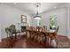 Formal dining room with hardwood floors, fireplace, large windows, and ample seating space for entertaining guests at 9261 Marvin School Rd, Marvin, NC 28173