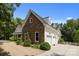 Home with a stone exterior, attached two car garage and manicured landscaping at 9261 Marvin School Rd, Marvin, NC 28173