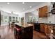 Spacious kitchen featuring a dark kitchen island, bar stool seating, and seamless access to the breakfast nook at 9261 Marvin School Rd, Marvin, NC 28173