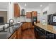 Well-equipped kitchen featuring custom cabinets, granite countertops, modern appliances, and a kitchen island at 9261 Marvin School Rd, Marvin, NC 28173