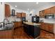Well-equipped kitchen featuring custom cabinets, granite countertops, modern appliances, and a kitchen island at 9261 Marvin School Rd, Marvin, NC 28173