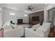 Spacious living room with fireplace, flat screen TV, ceiling fan and comfortable seating at 9261 Marvin School Rd, Marvin, NC 28173
