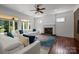 Bright living room with a cozy fireplace and large glass doors leading to the outside at 9261 Marvin School Rd, Marvin, NC 28173