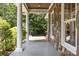 Stone exterior with white columns and a porch swing at 9261 Marvin School Rd, Marvin, NC 28173