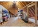 Large, unfinished attic space with exposed wood framing and ample storage at 9261 Marvin School Rd, Marvin, NC 28173