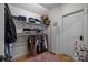 Walk-in closet with built-in shelving, hanging racks and a pink rug at 9261 Marvin School Rd, Marvin, NC 28173
