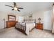 Bright bedroom features carpet, closet, and ceiling fan for cooling at 9319 Chislehurst Rd, Mint Hill, NC 28227