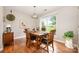 Charming dining room with natural light and wood table at 9319 Chislehurst Rd, Mint Hill, NC 28227