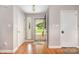 Inviting foyer with hardwood floors and convenient access to the front porch at 9319 Chislehurst Rd, Mint Hill, NC 28227