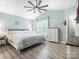 Serene main bedroom with a king-sized bed, a ceiling fan, a chest of drawers, and plenty of natural light at 1003 Snake River Ct, Monroe, NC 28110