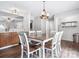 Kitchen and dining area with a wood table, white chairs, stainless steel appliances, and light wood cabinets at 1003 Snake River Ct, Monroe, NC 28110