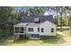 Rear view of home showcases the expansive deck and backyard, excellent for outdoor living at 1004 E Sandy Ridge Rd, Monroe, NC 28112