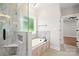 Bright bathroom featuring a walk-in shower, tub, and modern finishes at 1004 E Sandy Ridge Rd, Monroe, NC 28112