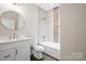 Bright bathroom with a bathtub/shower, vanity, and gold fixtures at 1004 E Sandy Ridge Rd, Monroe, NC 28112