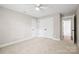 Carpeted bedroom with double closets and white trim, offering ample storage space at 1004 E Sandy Ridge Rd, Monroe, NC 28112
