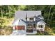 Charming exterior of a well-maintained home featuring a lovely front porch and attached garage at 1004 E Sandy Ridge Rd, Monroe, NC 28112