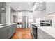 Modern kitchen with white cabinets, stainless steel appliances, and an island at 1004 E Sandy Ridge Rd, Monroe, NC 28112