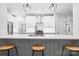 A modern kitchen with white cabinets, a breakfast bar, and pendant lighting at 1004 E Sandy Ridge Rd, Monroe, NC 28112